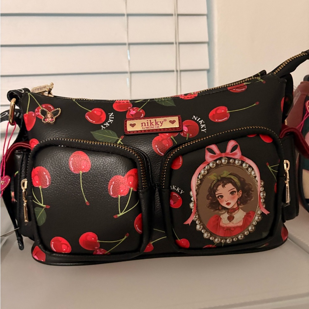 Nikky Black Cherry Print Crossbody Bag with Front Pockets